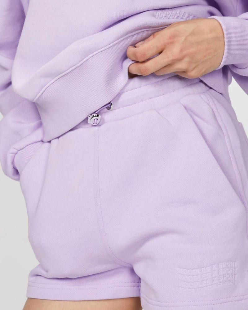 Back of a model wearing a size 3 (Large) Sweat Short With Logo In Purple in Purple by THE KOOPLES. | dia_product_style_image_id:355991